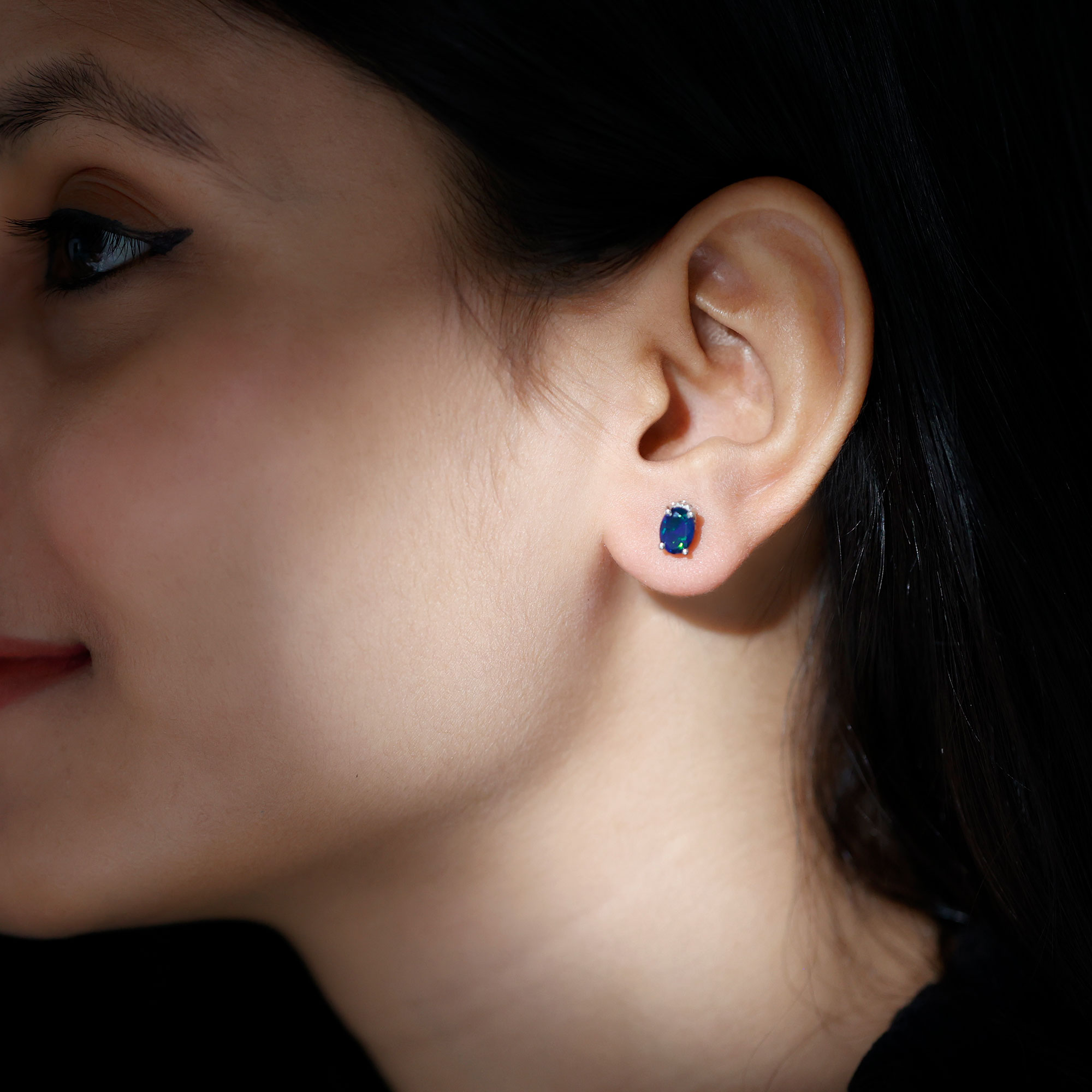 thumbnail video image 2 of Rosec Jewels Oval Black Opal Solitaire Stud Earrings with Moissanite (5X7 mm, AAA Quality), 925 Sterling Silver, 2 of 9