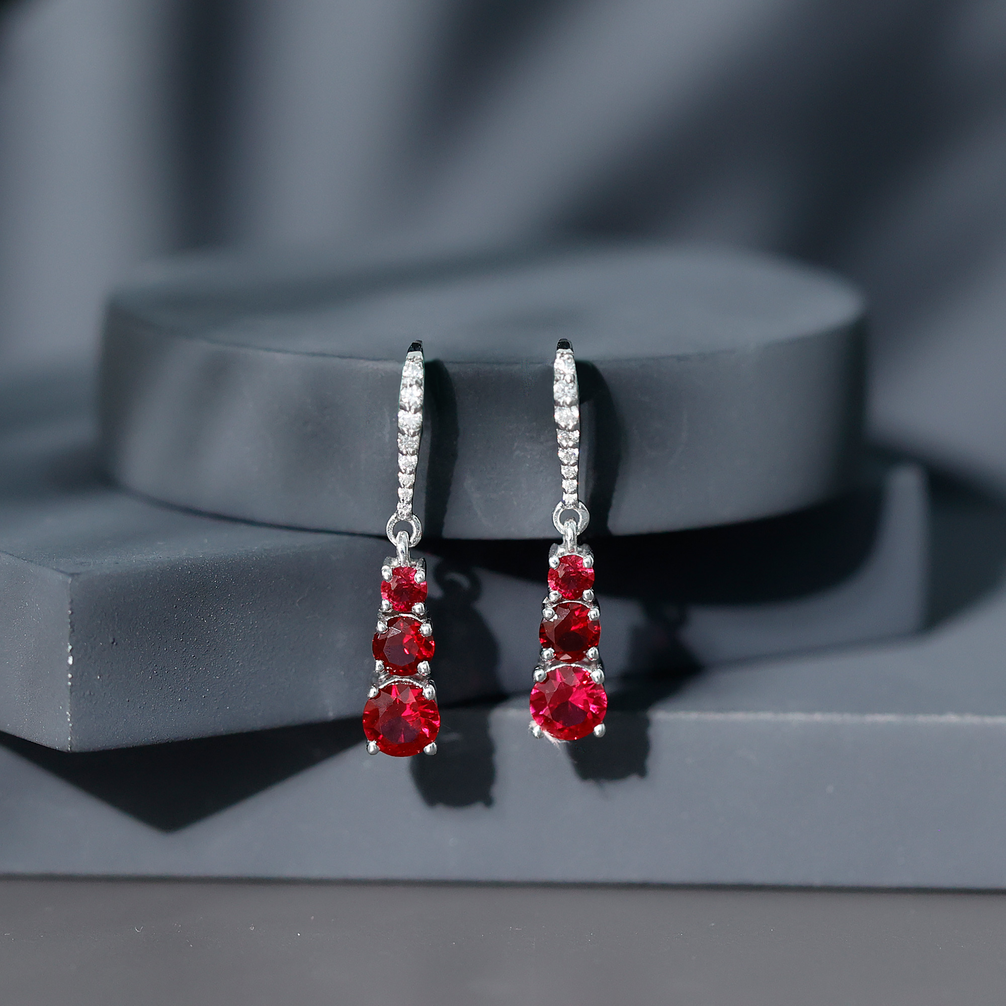 thumbnail video image 2 of Rosec Jewels Three Stone Drop Earrings for Women, Created Ruby Moissanite Earrings - AAAA Grade, 18K White Gold, 2 of 9