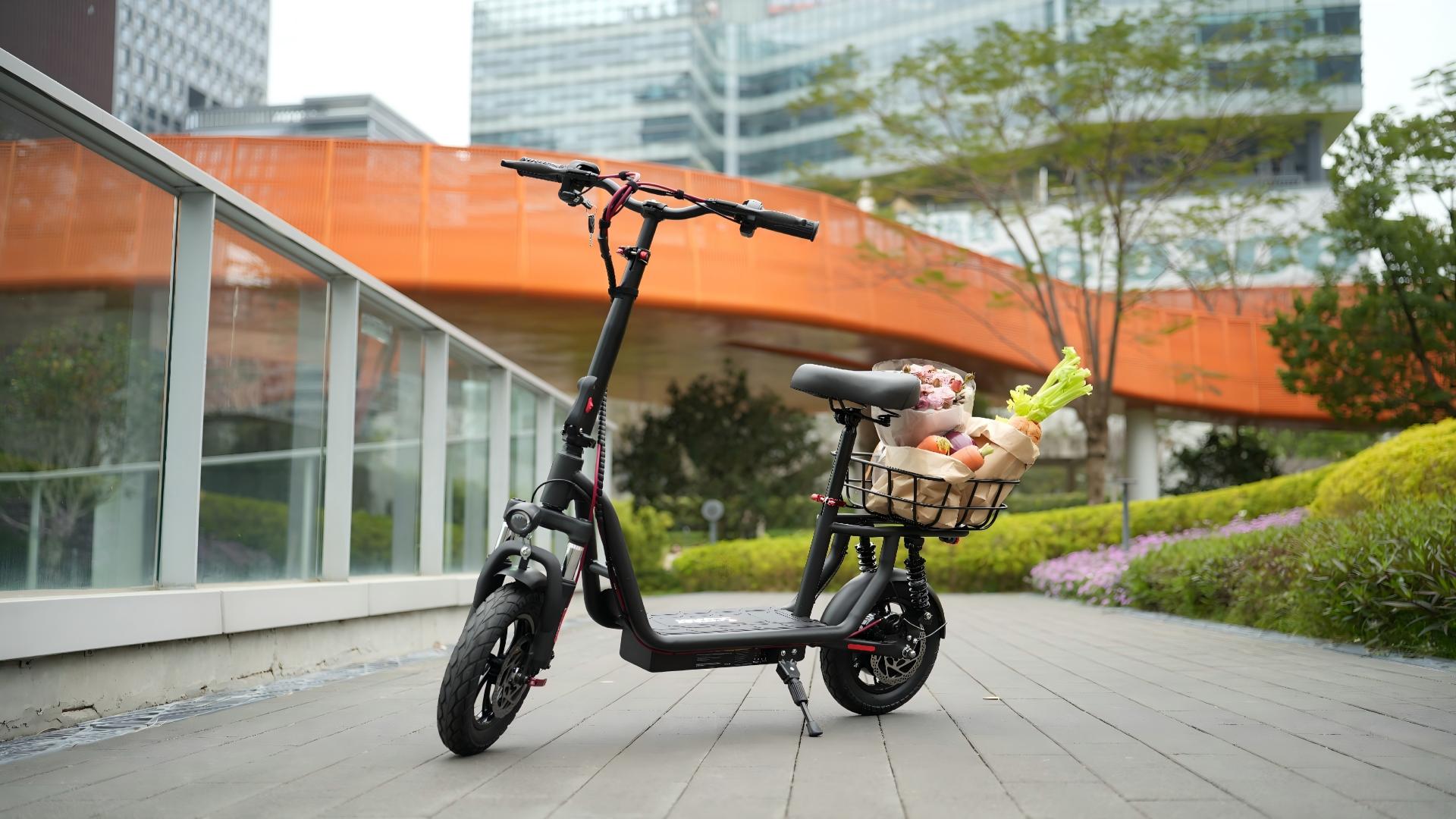 thumbnail video image 2 of iScooter 500W Electric Scooter with Seat for Adult, up to 21 Miles 15.5 MPH 12" Commuter Electric Scooter with Basket and Dual Shock Absorbers, 2 of 8