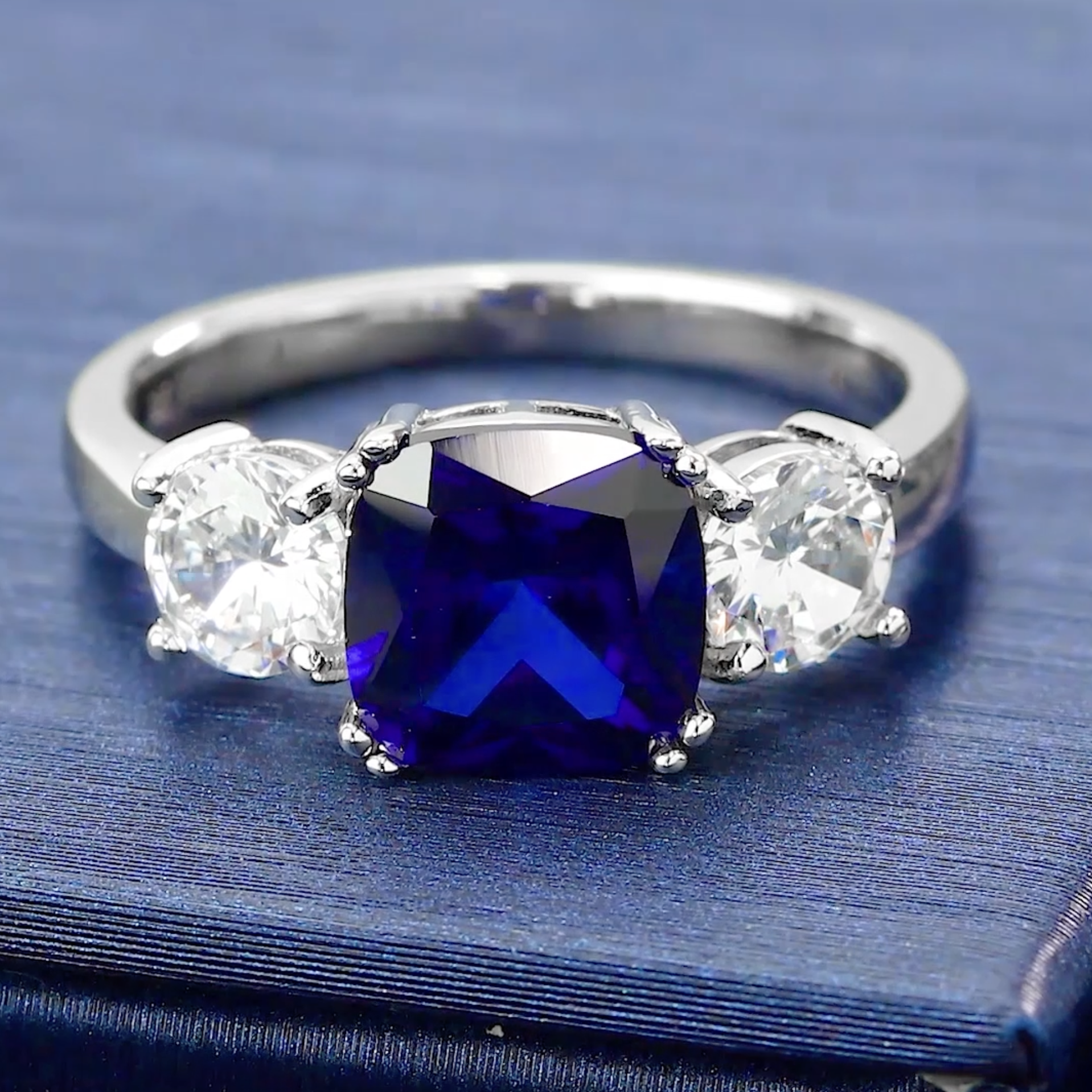 thumbnail video image 2 of 4.00 Ct Blue Simulated Sapphire Engagement Ring for Women | 925 Sterling Silver | Gemstone Birthstone | Cushion 8MM and Round 5MM | Three Stone Wedding Anniversary Promise Ring (Size 7), 2 of 7
