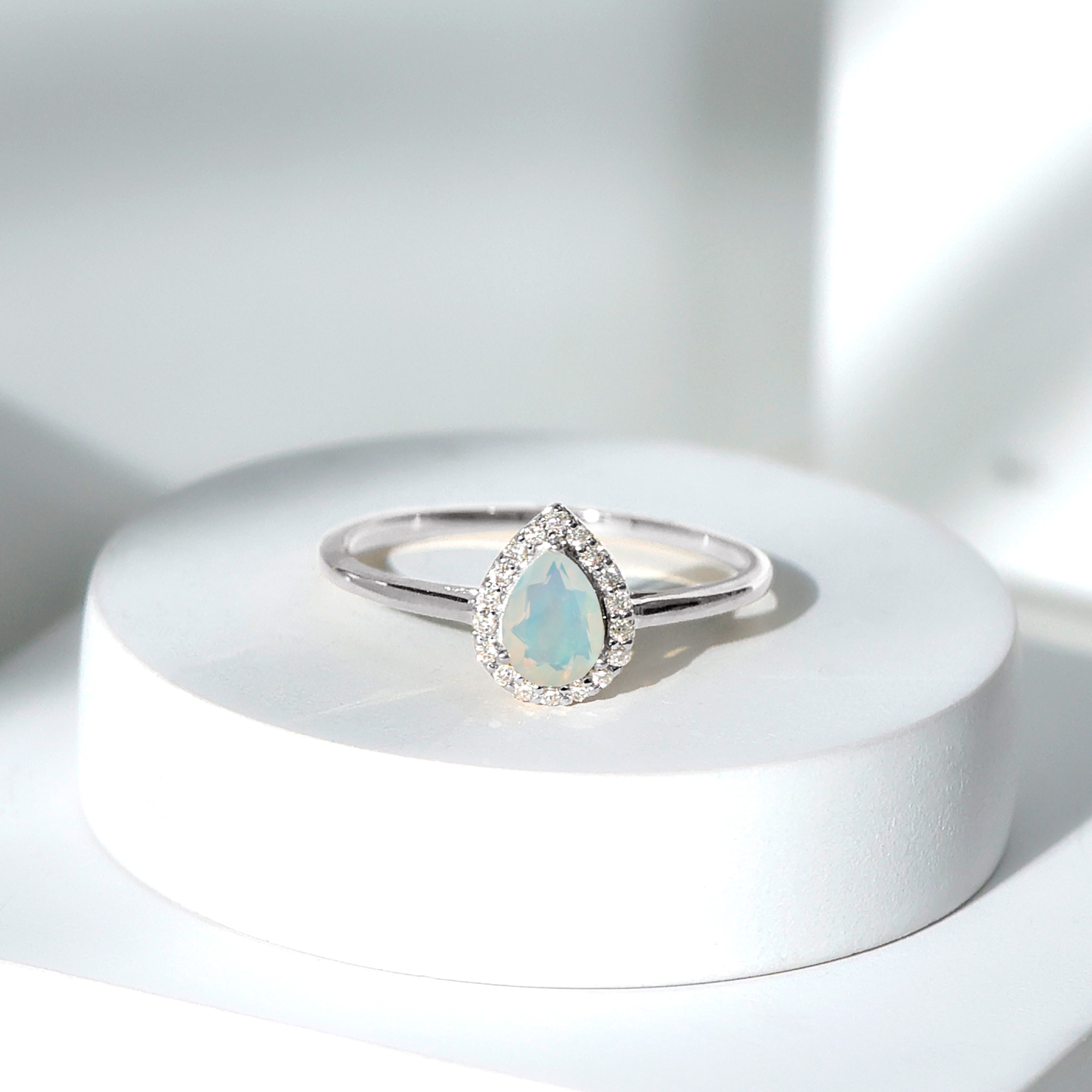 thumbnail video image 2 of Rosec Jewels Natural Ethiopian Opal Pear Shaped Engagement Ring with Halo - 5X7 mm - Opal Diamond Ring - AAA Quality, 925 Sterling Silver, US 4.00, 2 of 9