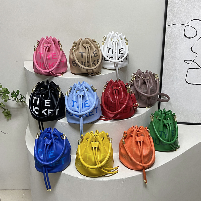 thumbnail video image 2 of Sunyuer Women Mini Drawstring Bucket Bag, Letter Print PU Leather Handbag, Fashion Detachable Adjustable Strap Crossbody Shoulder Purse for Daily Travel, 2 of 9