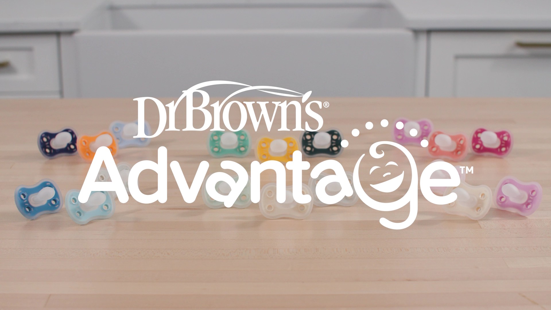 thumbnail video image 2 of Dr. Brown's Advantage One-Piece Silicone Baby Pacifier, Fully Symmetrical, Neutral, 0-6M, 3 Pack, 2 of 17