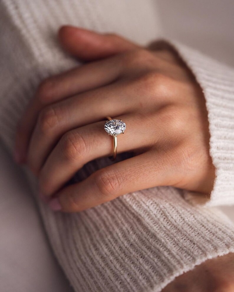 thumbnail video image 2 of SOLITAIRE JEWELS 3.1CT Oval Cut Moissanite Diamond Hidden Halo Engagement Ring, Anniversary Ring For Women, 18k Yellow Gold Solitaire Ring, 2 of 8