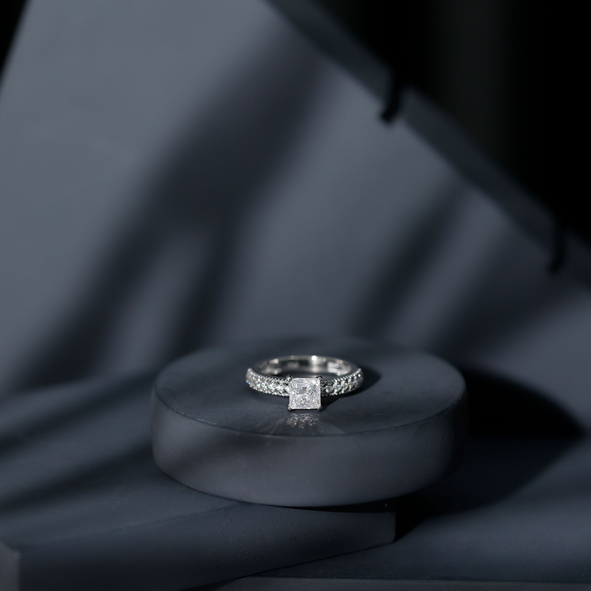 thumbnail video image 2 of Rosec Jewels Princess Cut Moissanite Engagement Ring with Side Stones - 5 mm - D-VS1 Grade, 18K White Gold, US 3.00, 2 of 9