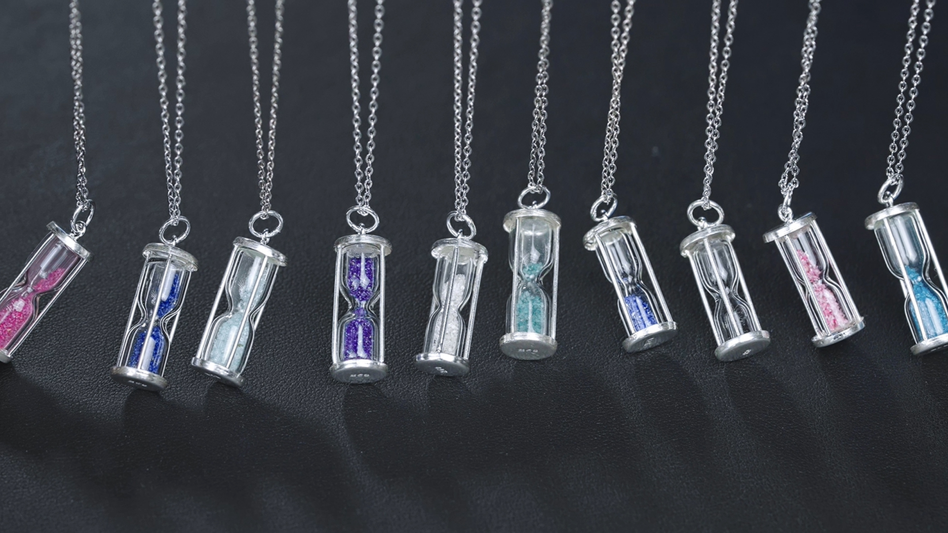 thumbnail video image 2 of Gem Stone King 925 Sterling Silver Hourglass Pendant Necklace for Women with 0.75 Ct Emerald Dust and 18 inch Silver Chain, 2 of 6