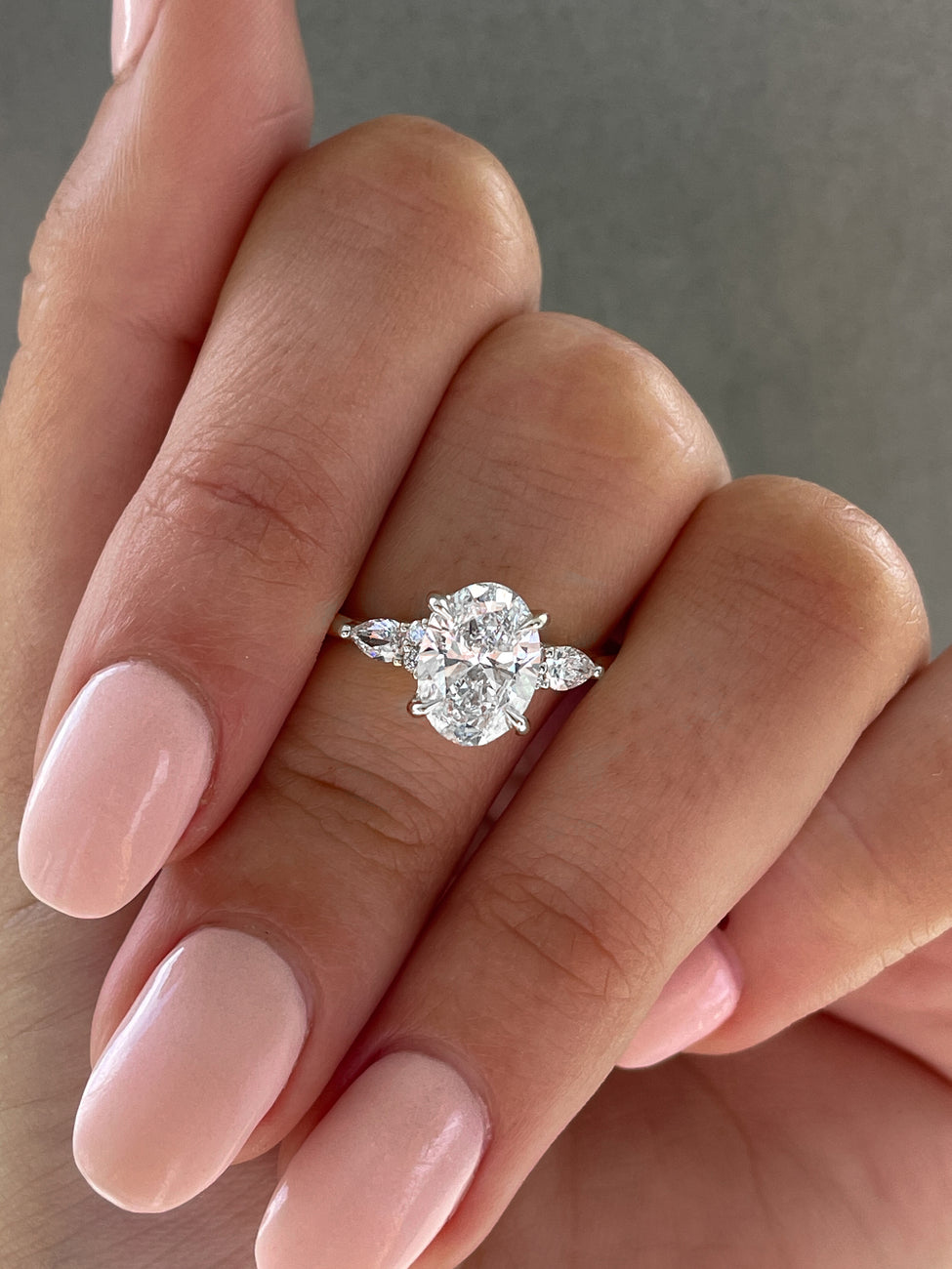 thumbnail video image 2 of solitaire jewels Tulip Setting Oval Moissanite With Side Pear Muse Setting Engagement Ring For Women, 10K White Gold, 2 of 6