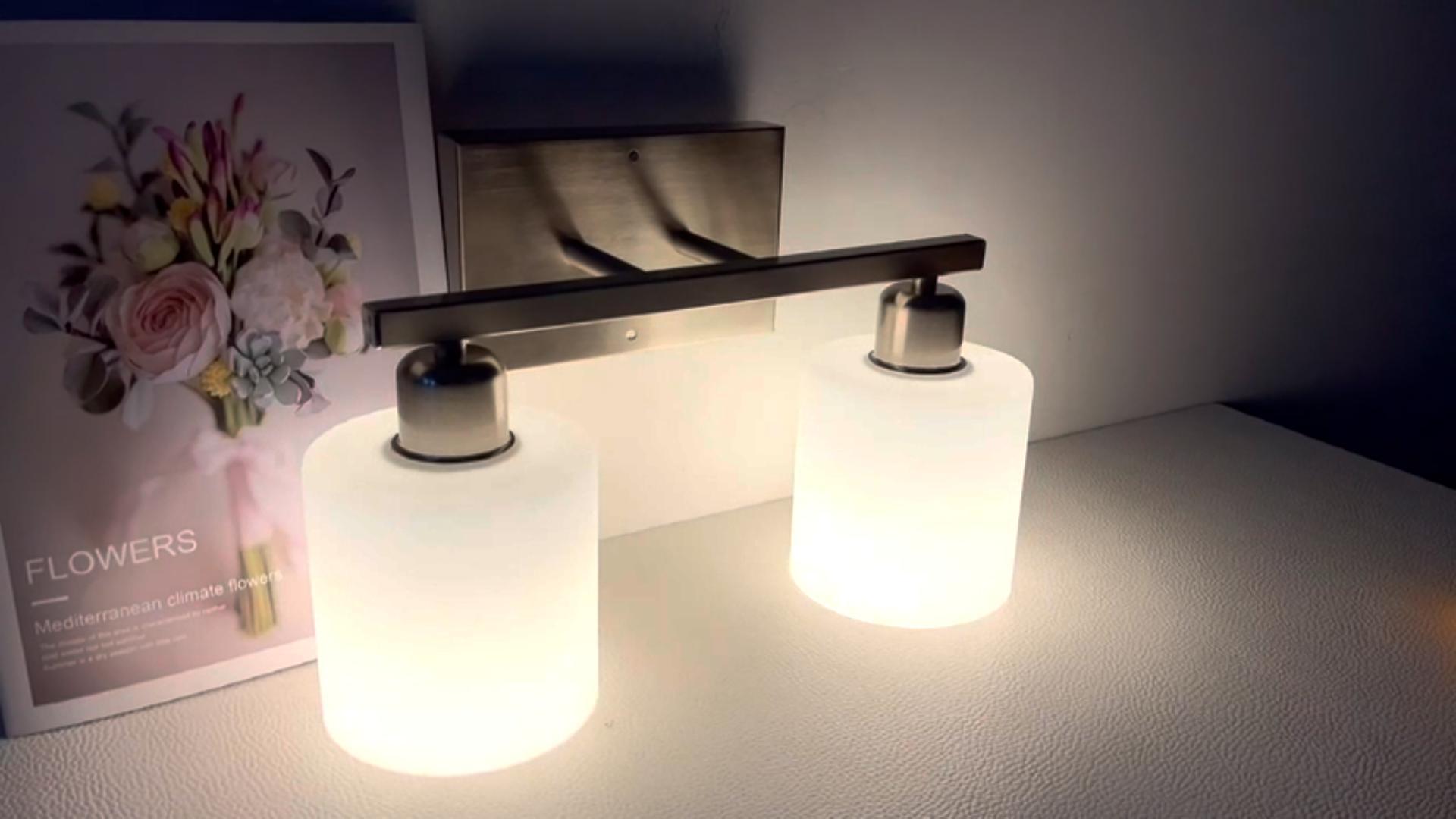 thumbnail video image 2 of Sailstar 2-Light Brushed Nickel Dimmable Vanity Light with White Frosted Glass Shades, 2 of 10