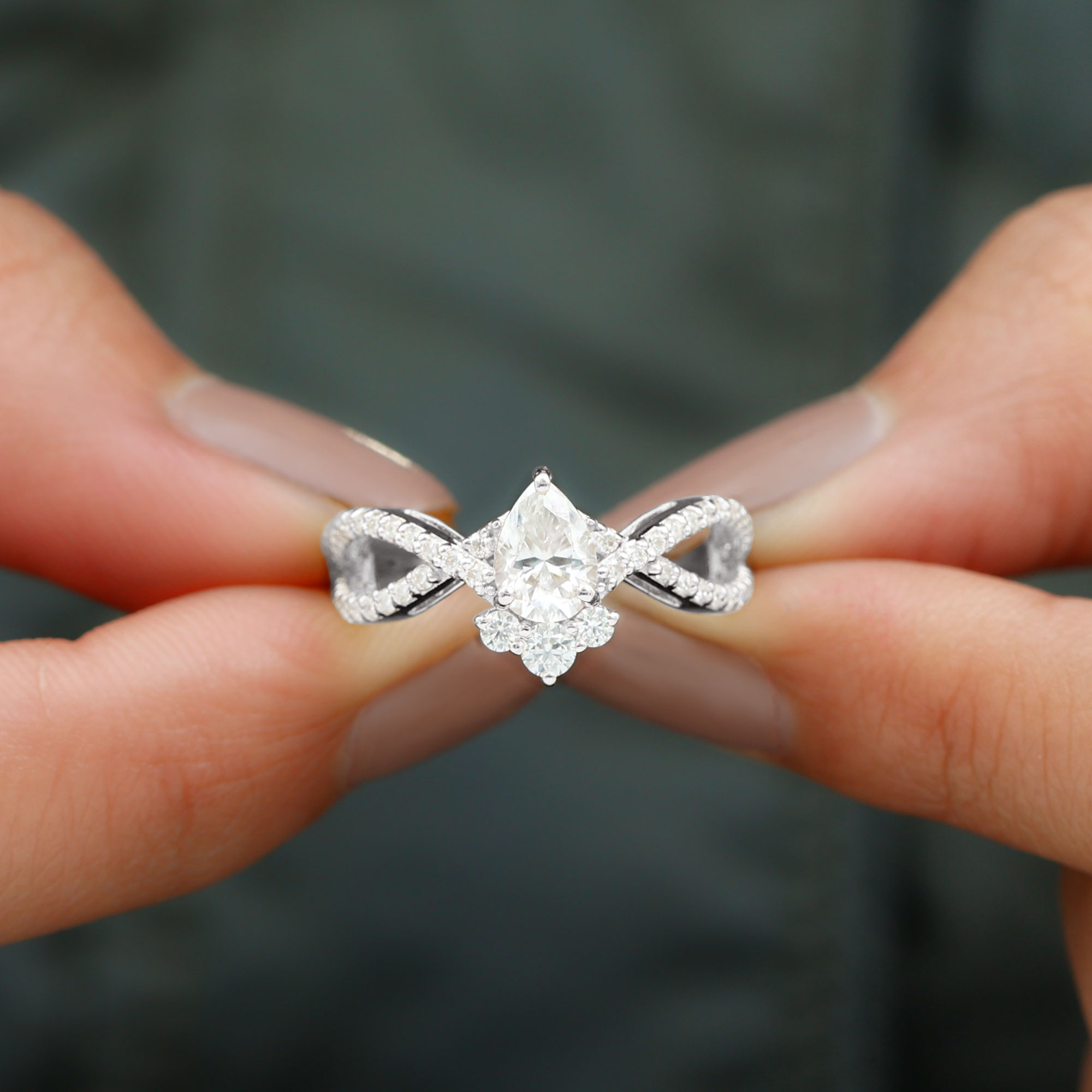 thumbnail video image 2 of Rosec Jewels Certified Moissanite Engagement Ring - Designer Crossover Ring for Women - 5X7 mm Pear - D-VS1 Grade, 925 Sterling Silver, US 4.00, 2 of 9