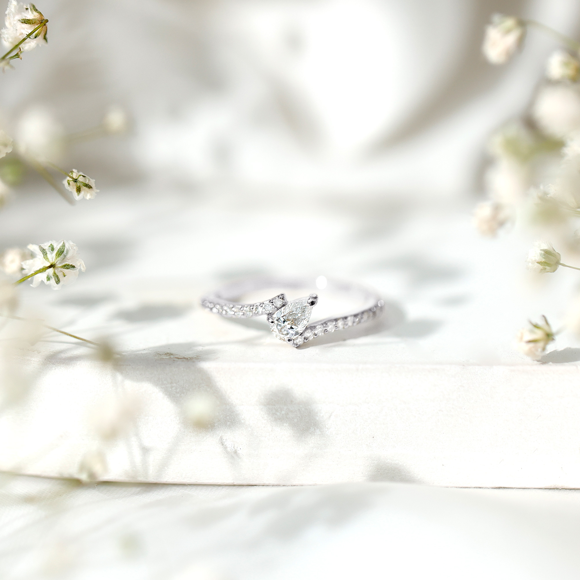 thumbnail video image 2 of Rosec Jewels Pear Moissanite Bypass Engagement Ring with Side Stones (0.25 CT, D-VS1 Grade), 925 Sterling Silver, US 7.50, 2 of 9