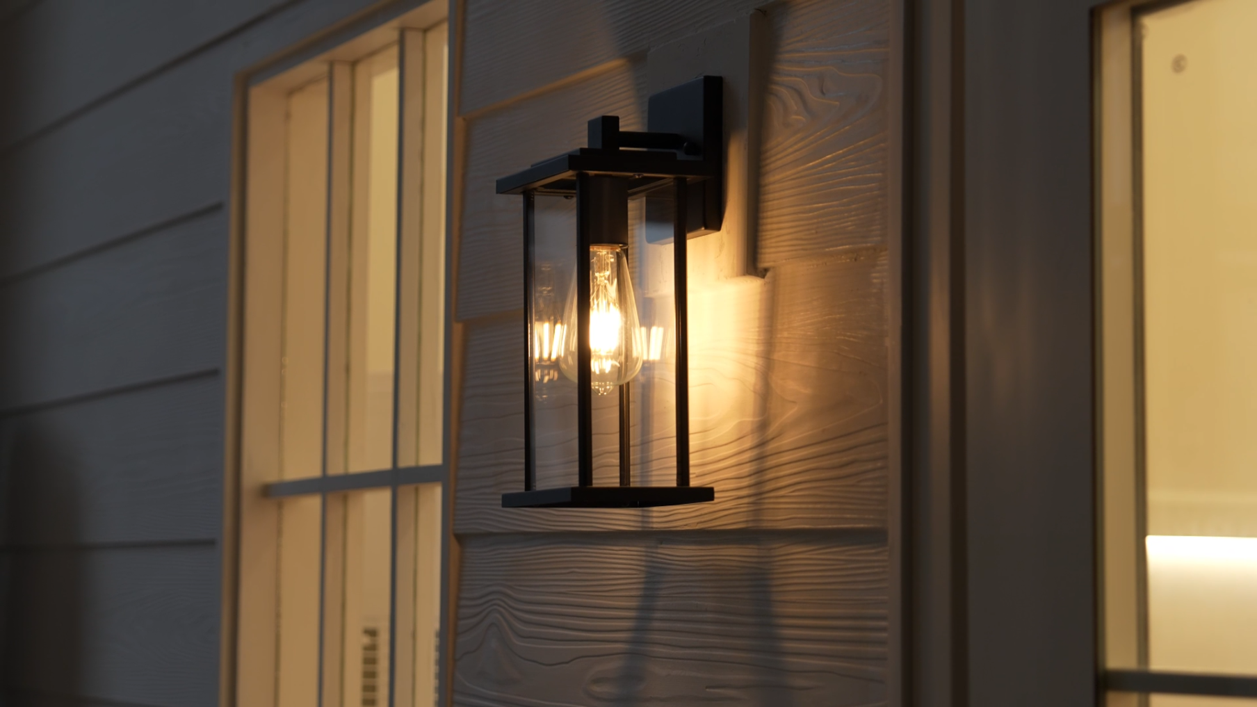 thumbnail video image 2 of C Cattleya 2-Pack Matte Black Outdoor Wall Lights with Clear Glass Shade, 2 of 7
