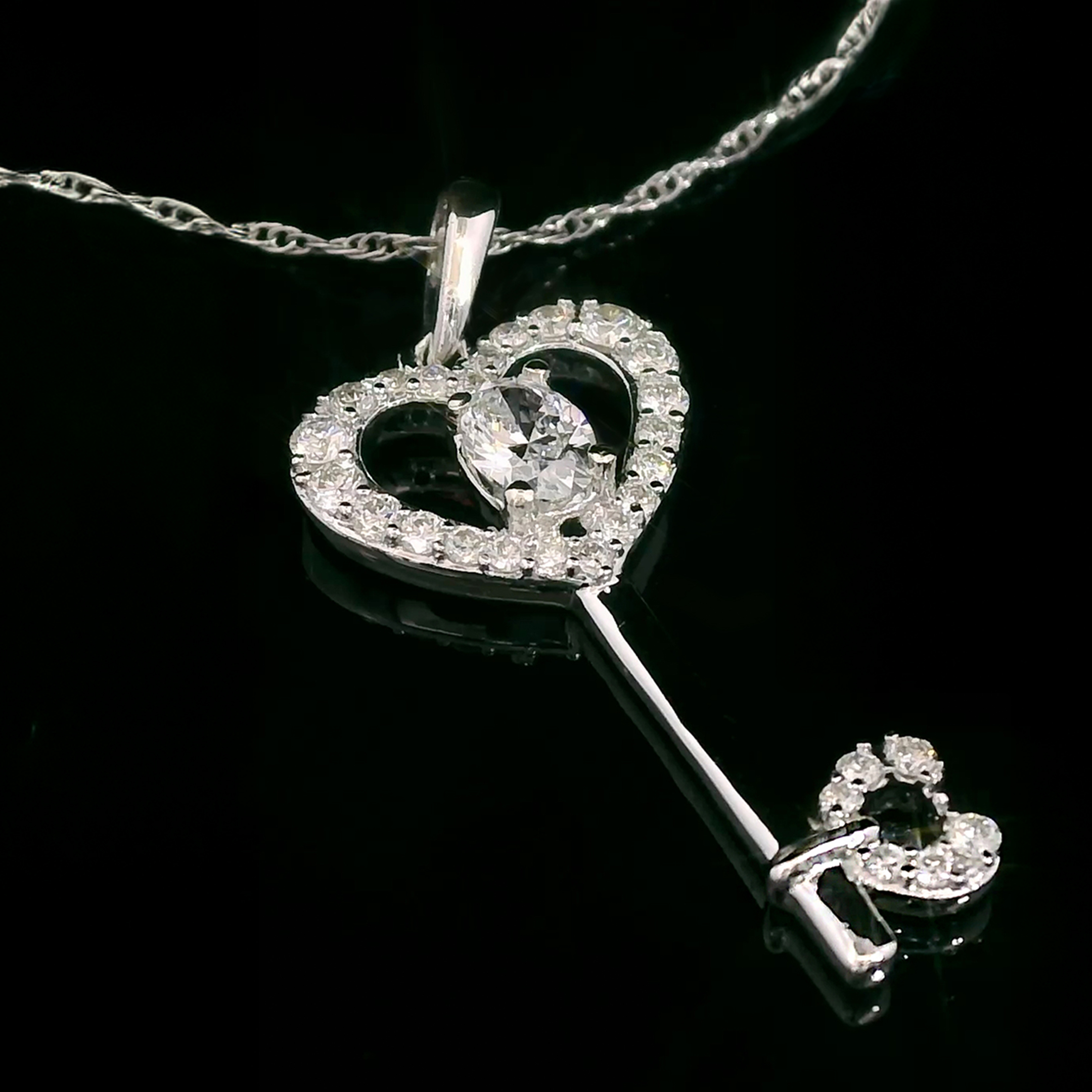 thumbnail video image 2 of Gem Stone King 10K White Gold Black Sapphire and White Lab Grown Diamond Heart Shape Key Pendant Necklace for Women (0.36 Cttw, Gemstone September Birthstone, with 18 inch Chain), 2 of 5