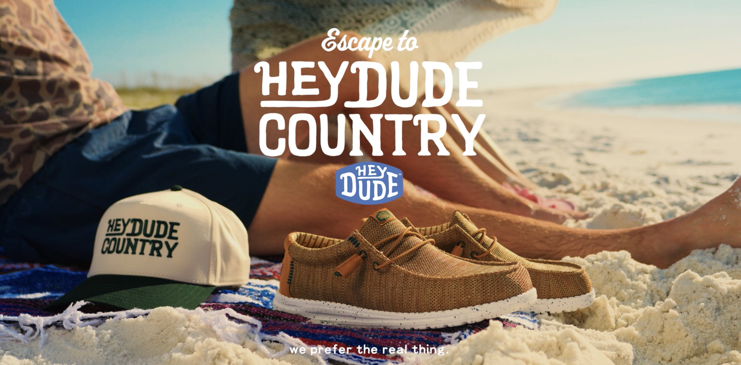 thumbnail video image 2 of HEYDUDE Wally Stretch Canvas Slip-On Loafers Blue, 12, 2 of 7