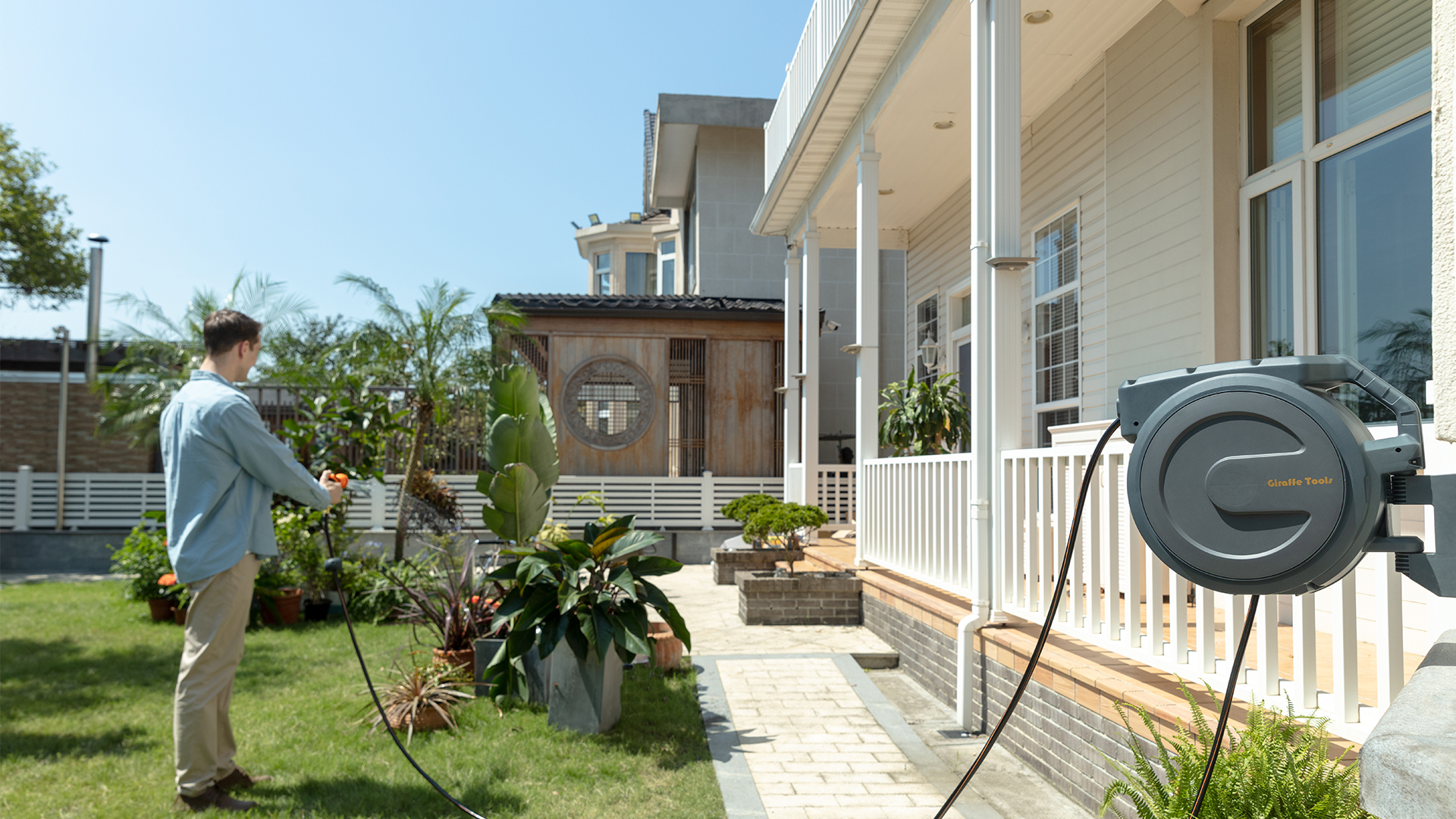 thumbnail video image 2 of Giraffe Tools Retractable Garden Hose Reel with 1/2in-130ft Hose, Metal Bracket, Wall Mounted, Dark Grey, 2 of 9