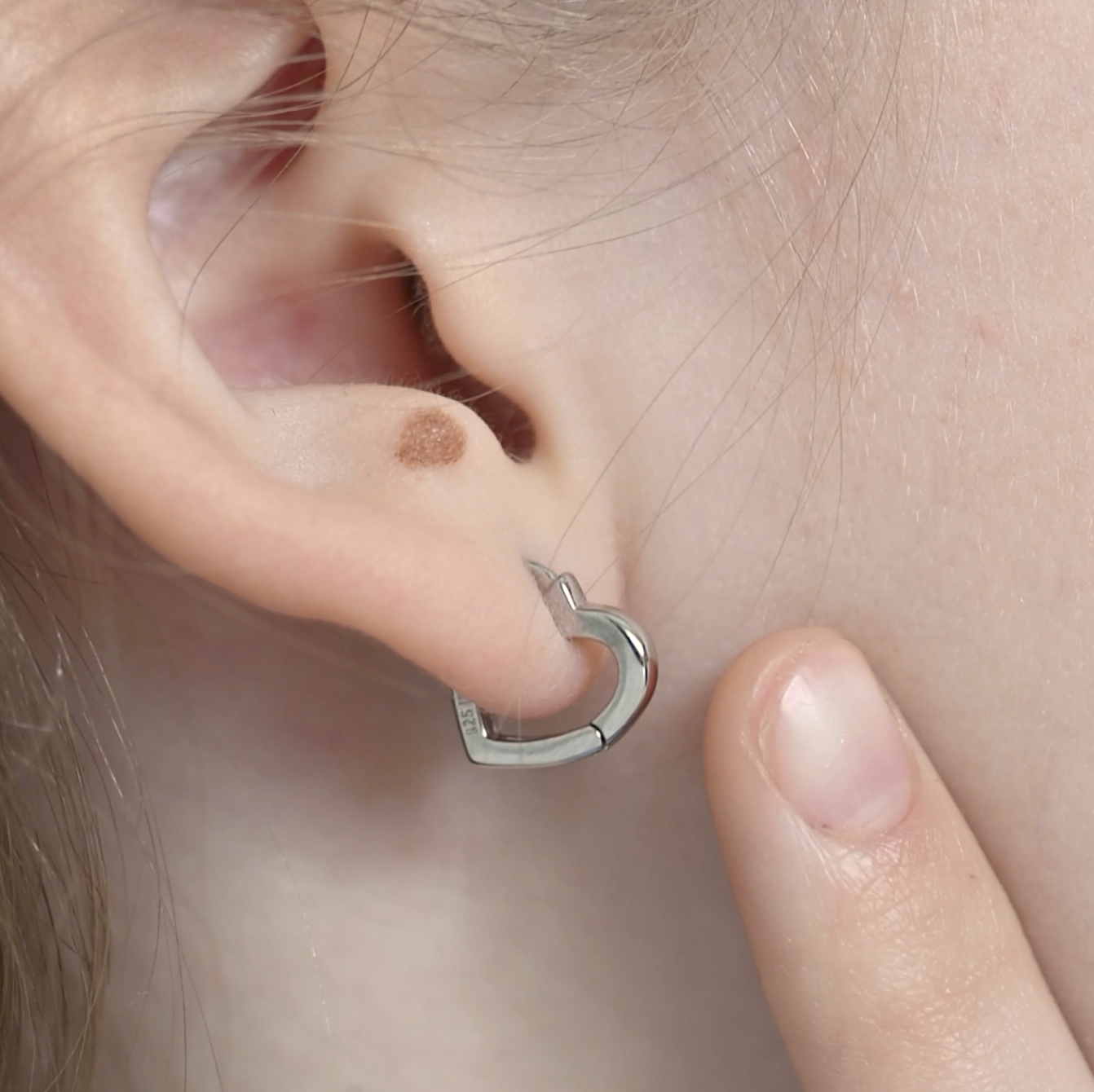 thumbnail video image 2 of Heart Shaped 8mm Baby / Toddler Earrings Hoop Safety Latch - Sterling Silver, 2 of 7