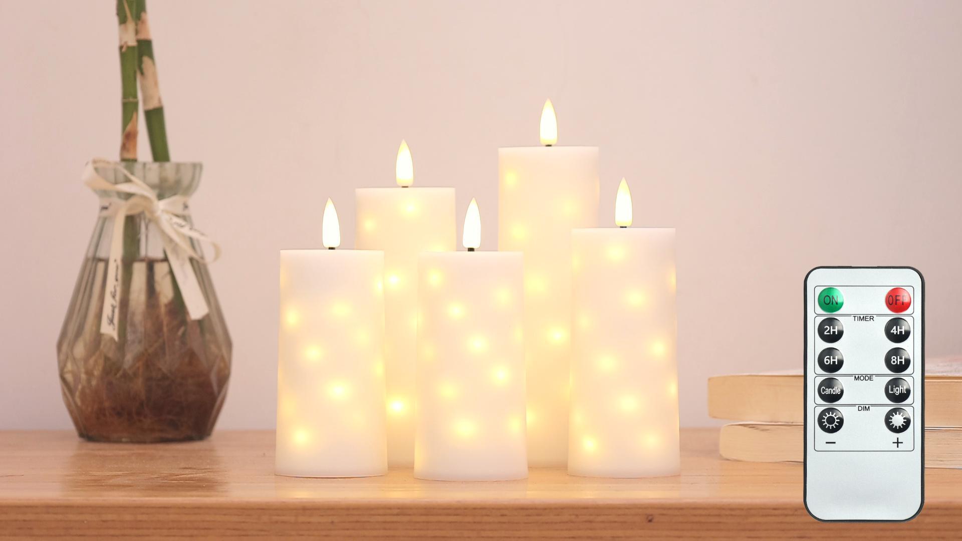 thumbnail video image 2 of Goyuon Flameless LED Candles 5 Pack with Timer Remote, Embedded Star String Lights, Battery Operated Flickering Candles, Ivory White Acrylic, 2 of 9