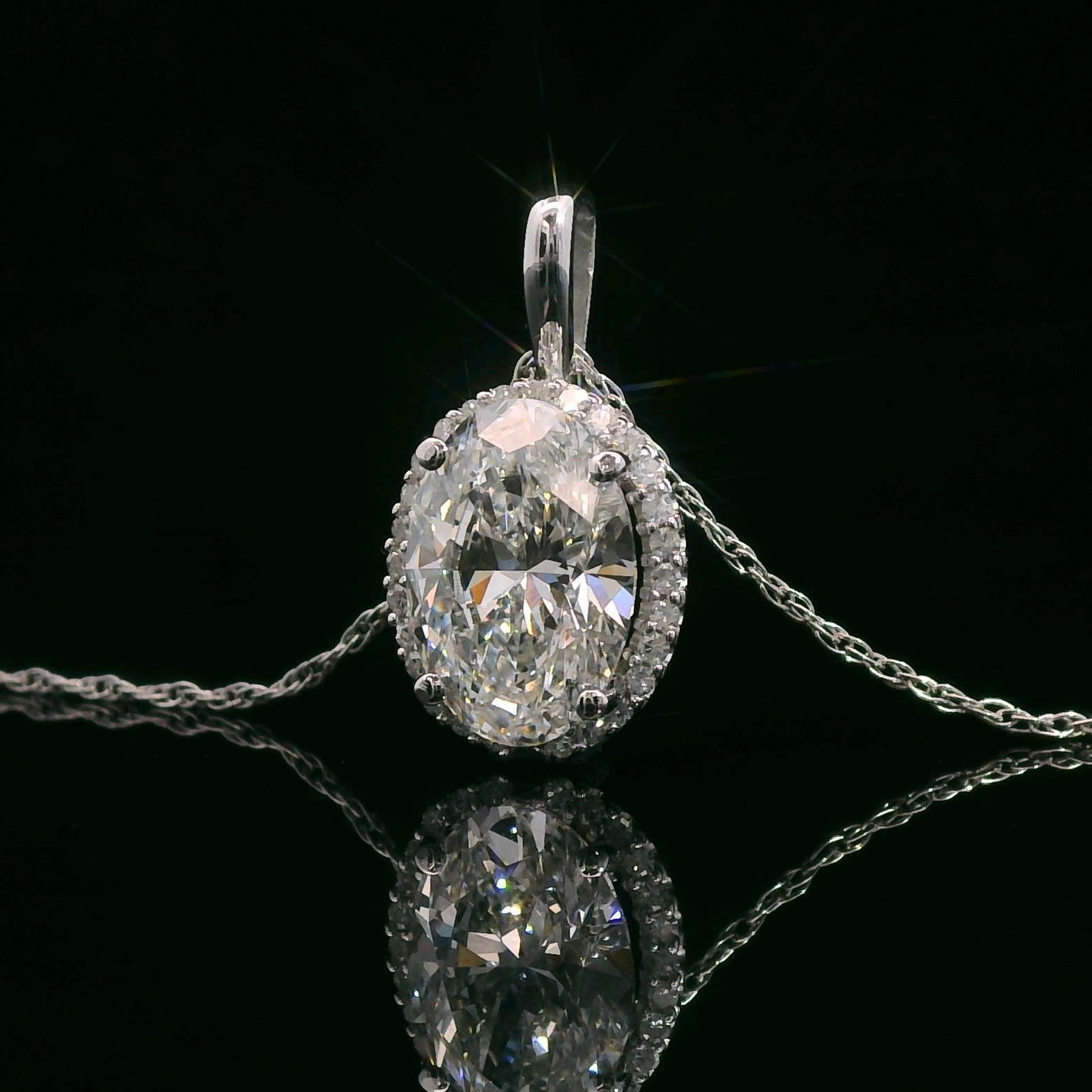 thumbnail video image 2 of Gem Stone King 10K White Gold Pendant Forever One Oval 1.50cttw Moissanite by Charles & Colvard, 2 of 6