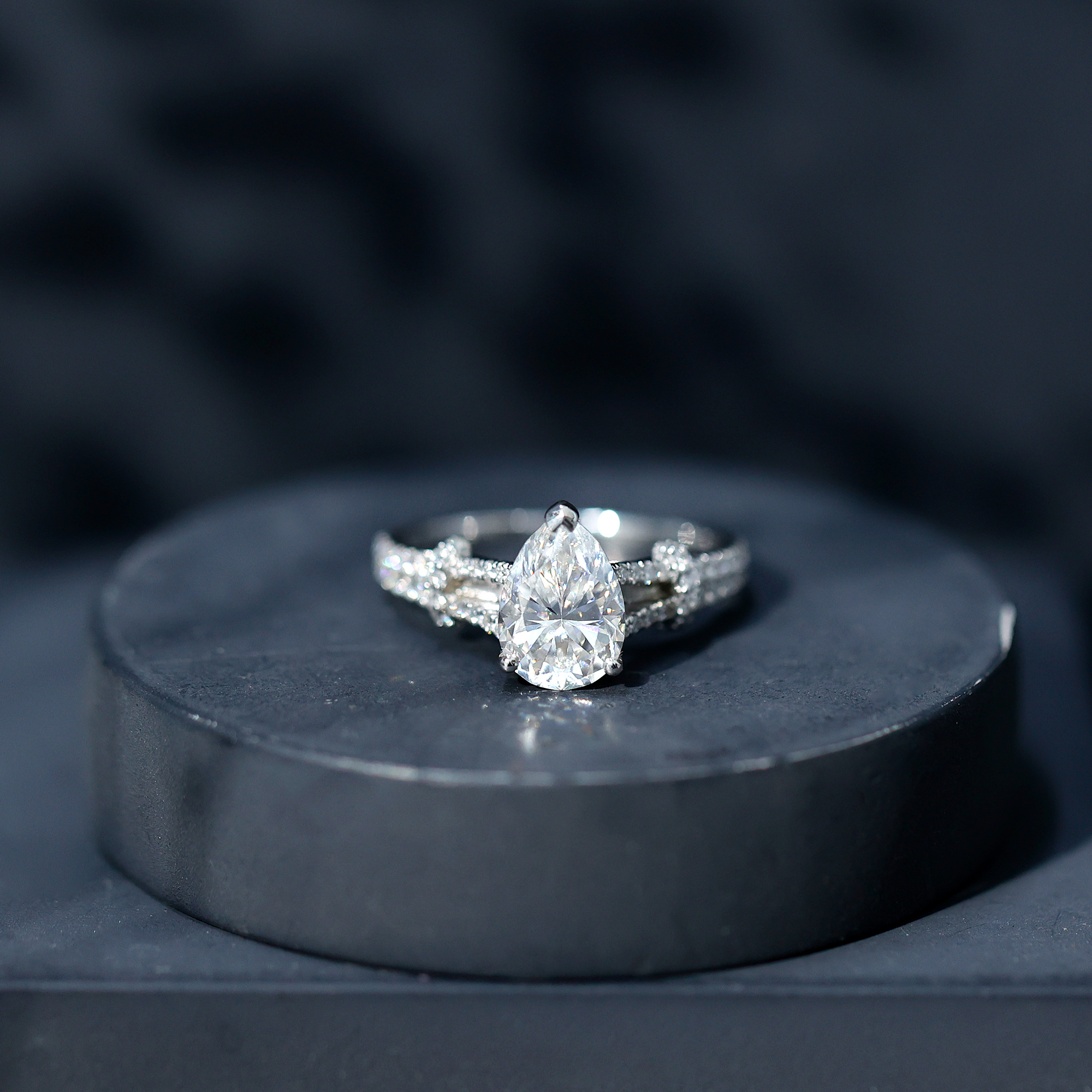 thumbnail video image 2 of Rosec Jewels Moissanite Pear Shape Engagement Ring 2 Carat - 7X10 mm - D-VS1 Quality Moissanite Split Shank Ring, 18K White Gold, US 10.50, 2 of 9