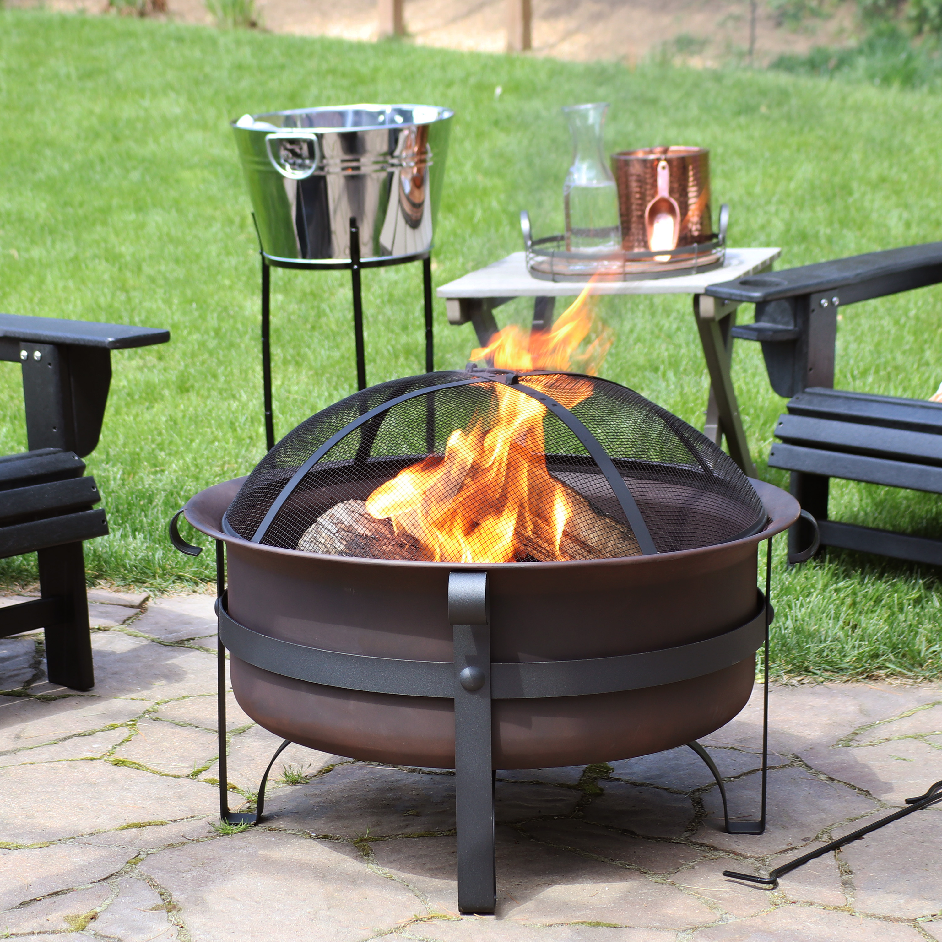thumbnail video image 2 of Sunnydaze 29" Round Wood-Burning Bronze Finish Steel Fire Pit Bowl with Spark Screen and Poker, 2 of 11