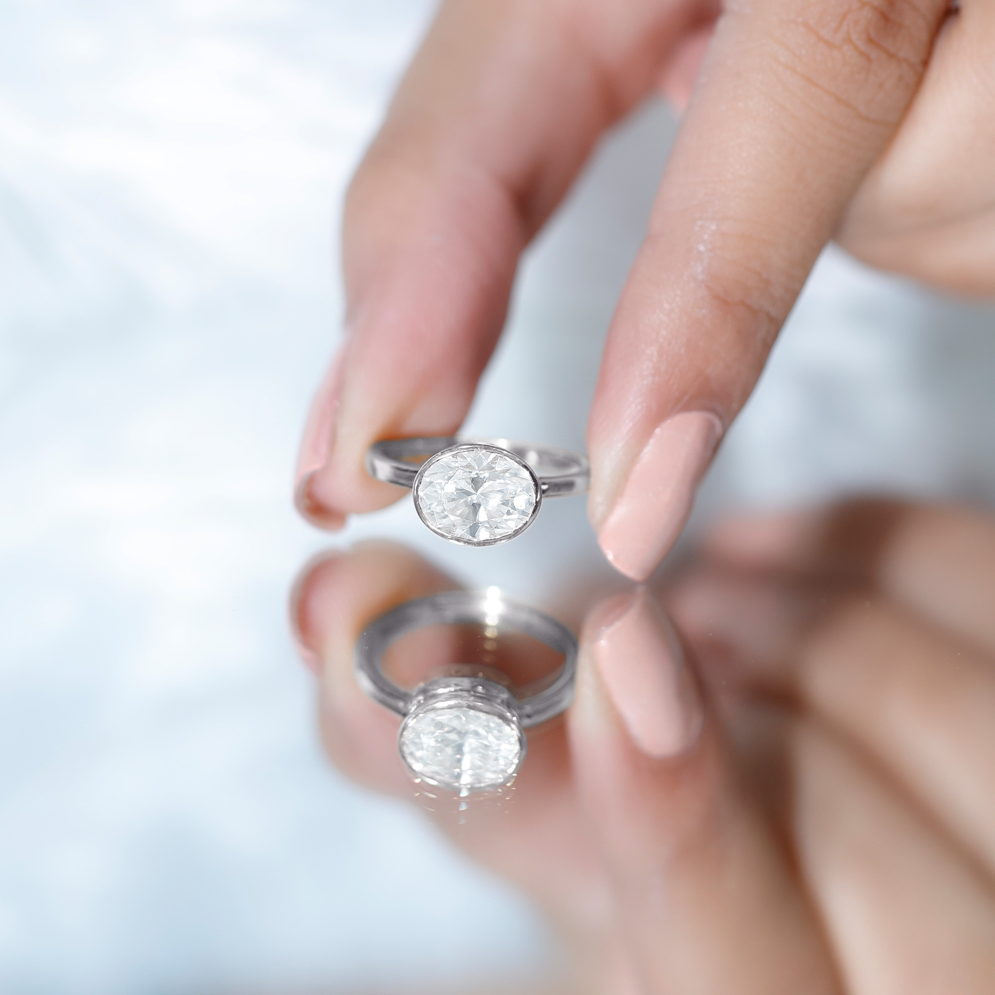 thumbnail video image 2 of Rosec Jewels Oval Moissanite East West Engagement Ring 2 Carat - 7X9 mm Moissanite Bezel Set Ring - D-VS1 Quality, 14K Yellow Gold, US 10.00, 2 of 7