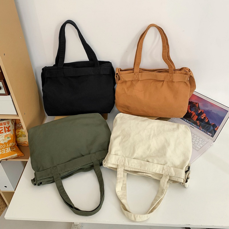 thumbnail video image 2 of Sunyuer Vintage Canvas Tote Bag for Women Men, Casual Messenger Bag Large Crossbody Bag Working Shoulder Bag with Pockets, 2 of 8