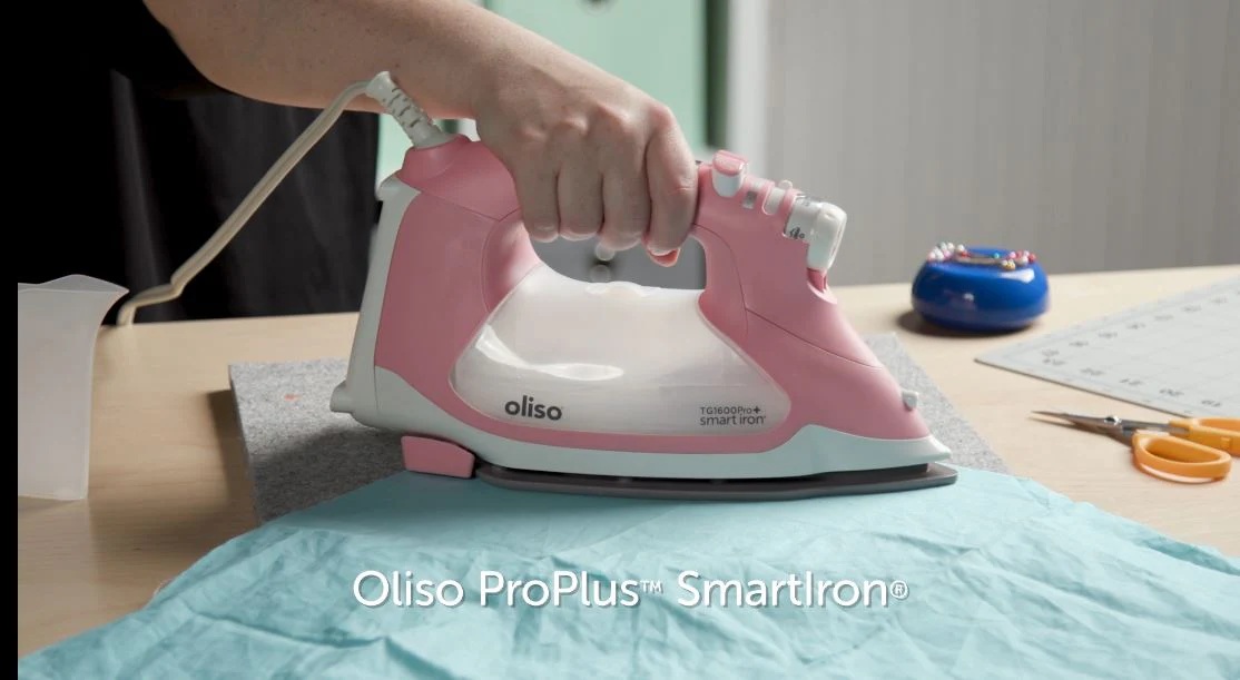 thumbnail video image 2 of Oliso TG1600 Pro Plus 1800 Watt SmartIron with Auto Lift - for Clothes, Sewing, Quilting and Crafting Ironing | Diamond Ceramic-Flow Soleplate Steam Iron, Pink, 2 of 8