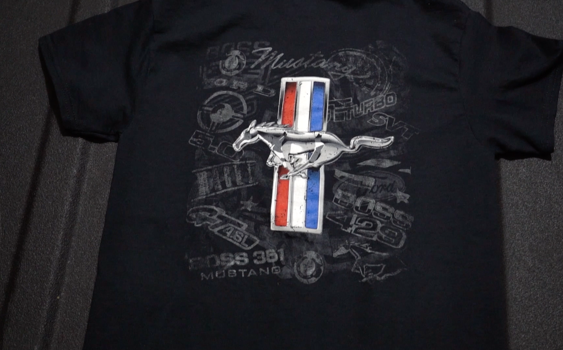 thumbnail video image 2 of JH Design Group Mens Ford Mustang Tri-Bar Pony Distressed Collage T-Shirt, 2 of 8