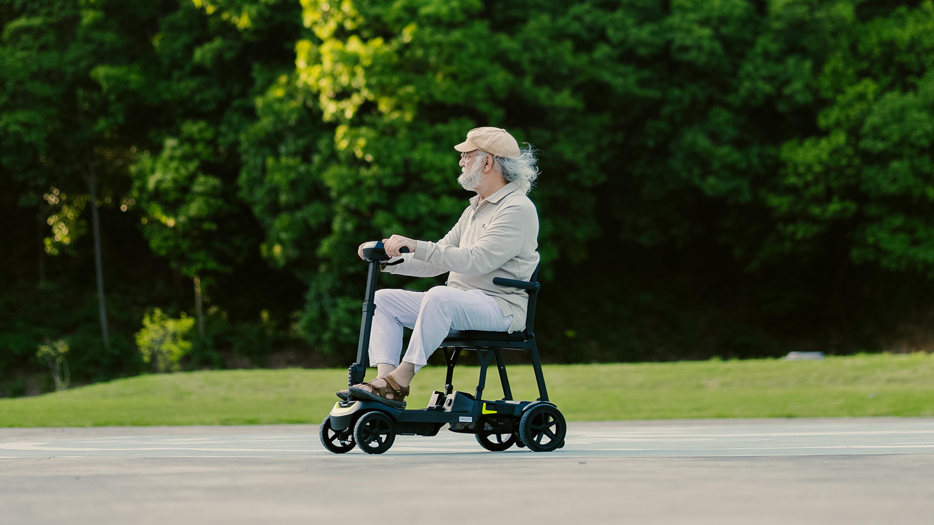 thumbnail video image 2 of ScootNGo 39lbs Ultra Lightweight Foldable 4-Wheel Electric Mobility Scooter for Seniors, Airline Approved Dual Battery, Yellow with Storage Trailer, 2 of 9