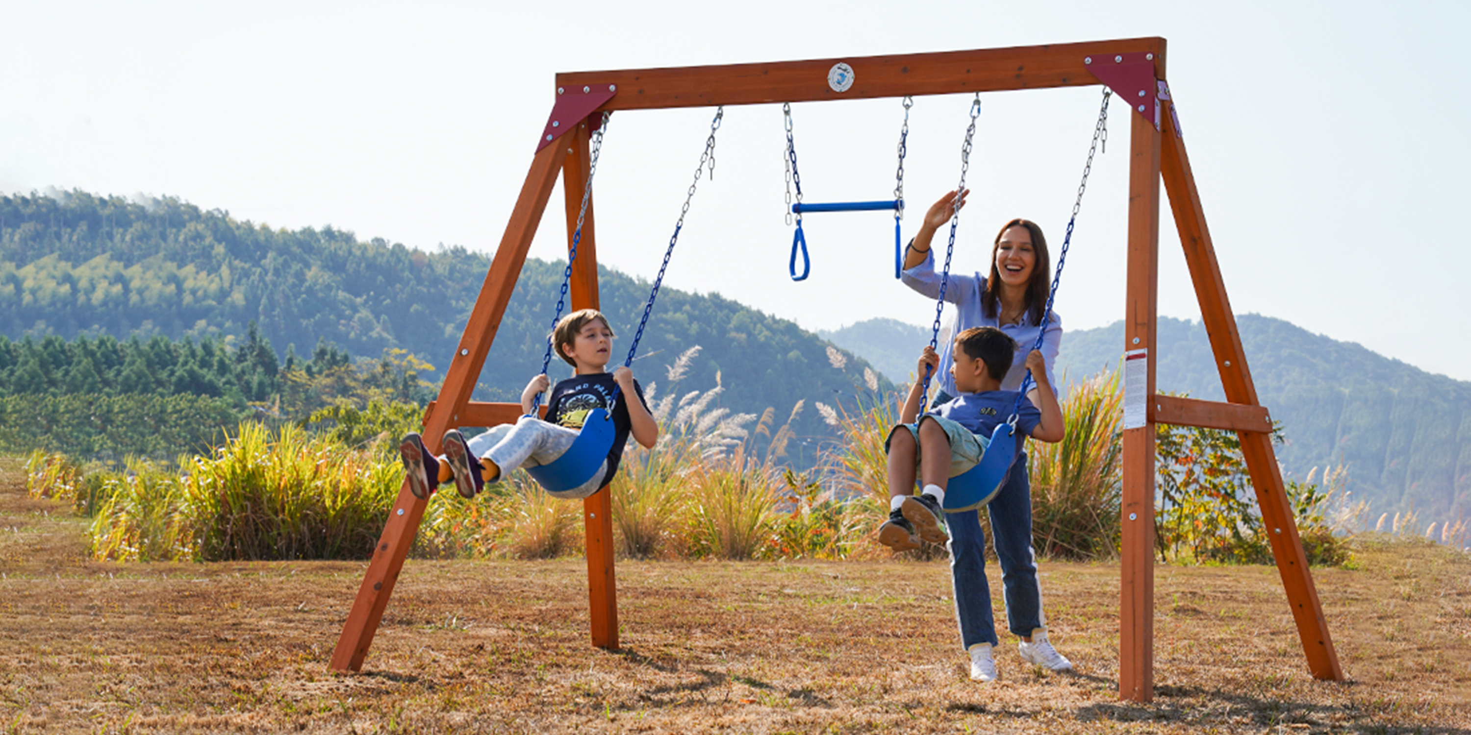 thumbnail video image 2 of Dolphin Playground Wooden Swing Set – Backyard Fun for Ages 3-12, 2 of 14