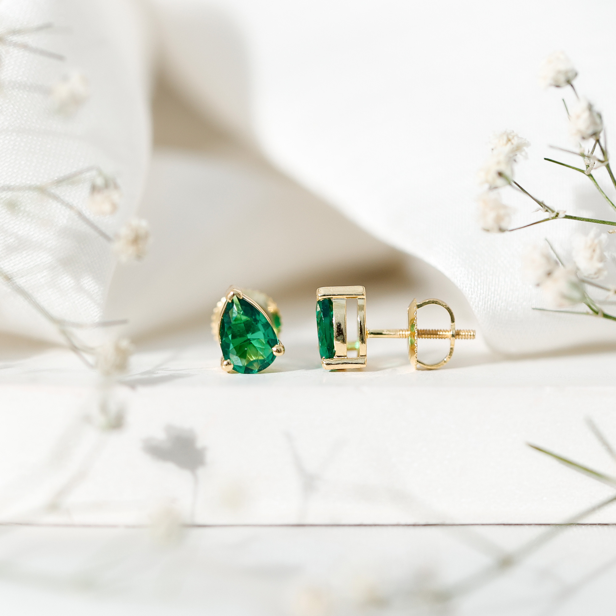 thumbnail video image 2 of Rosec Jewels Pear Shape Created Emerald Solitaire Stud Earrings (5X7 mm, 1.4 CT), 925 Sterling Silver, 2 of 8