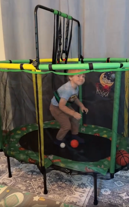 thumbnail video image 2 of 60" Toddler Trampoline with Safety Enclosure Net, SEGMART Upgraded Kids Trampoline with Basketball Hoop, Swing, Rings, Balls, Indoor Outdoor Mini Trampoline Birthday Gift for Kids Ages 3-9, 2 of 14
