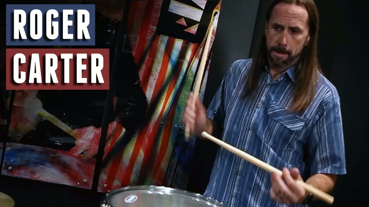 thumbnail video image 2 of Vic Firth SRC Roger Carter Signature Corpsmaster® Hickory Snare Drum Sticks w/ Wood Tip, 2 of 3