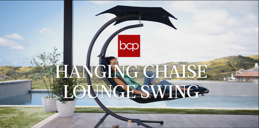thumbnail video image 2 of Best Choice Products Hanging Curved Chaise Lounge Chair Swing for Backyard, Patio w/ Pillow, Shade, Stand - Orange, 2 of 8
