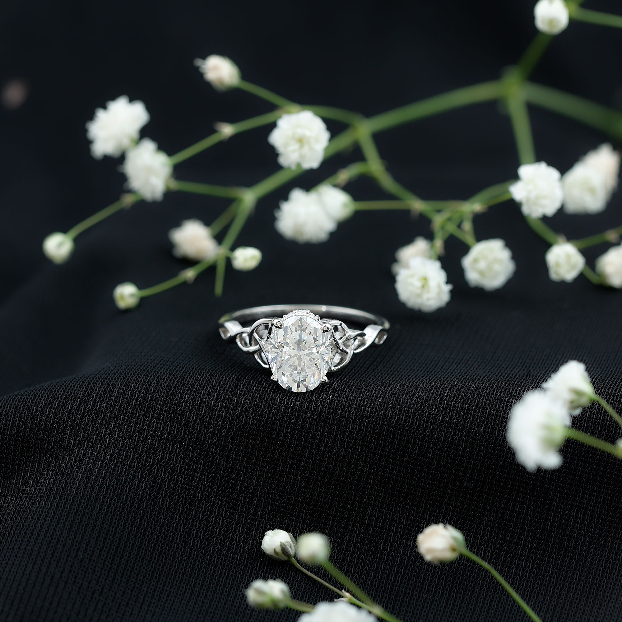 thumbnail video image 2 of Oval Moissanite Solitaire Celtic Knot Ring with Hidden Halo - 7x9 mm - 2 Ct - D-VS1 Grade, 10K White Gold, US 6.25, 2 of 9