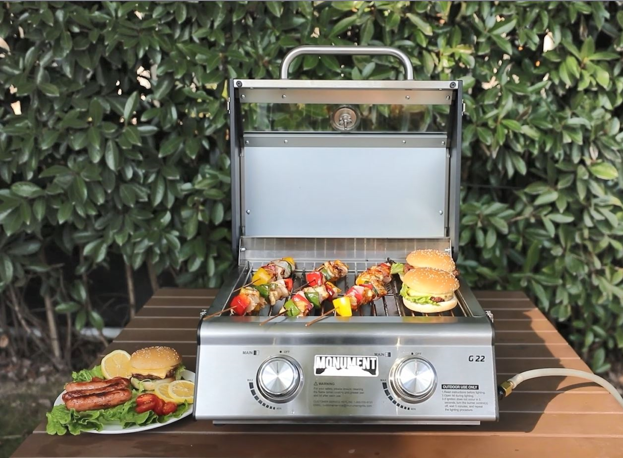 thumbnail video image 2 of Monument Grills Portable 2-Burner Tabletop Propane Gas Grill with Locking Clearview Lid, Stainless Steel, 2 of 10