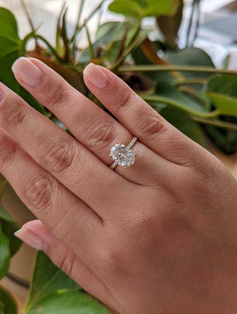 thumbnail video image 2 of SOLITAIRE JEWELS 3.20Ct Oval Moissanite Diamond Pave And Hidden Halo Engagement Ring 14K Yellow Gold, 2 of 8