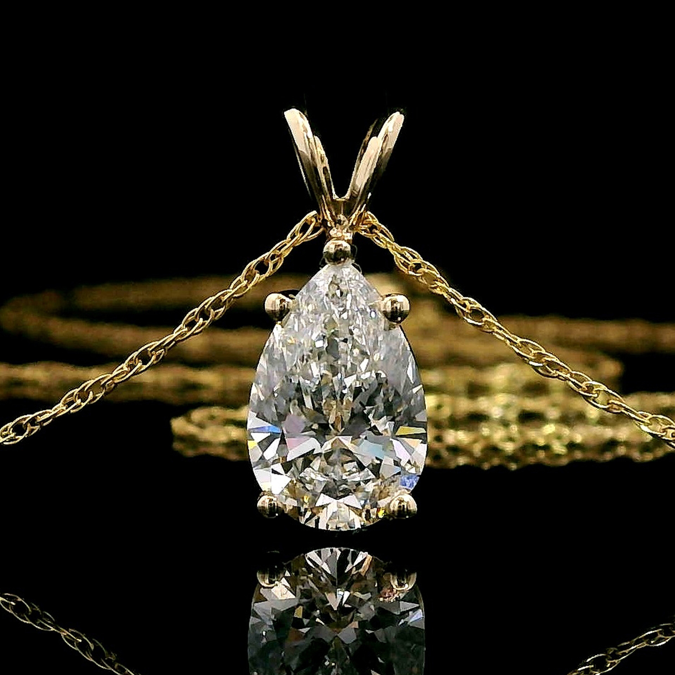 thumbnail video image 2 of Gem Stone King 1.50 Cttw IGI Certified Lab Grown Diamond Pendant Necklace for Women in 14K Yellow Gold | Pear Shape Diamond | D-E Color | VS1 Clarity | With 18 inch Chain, 2 of 7