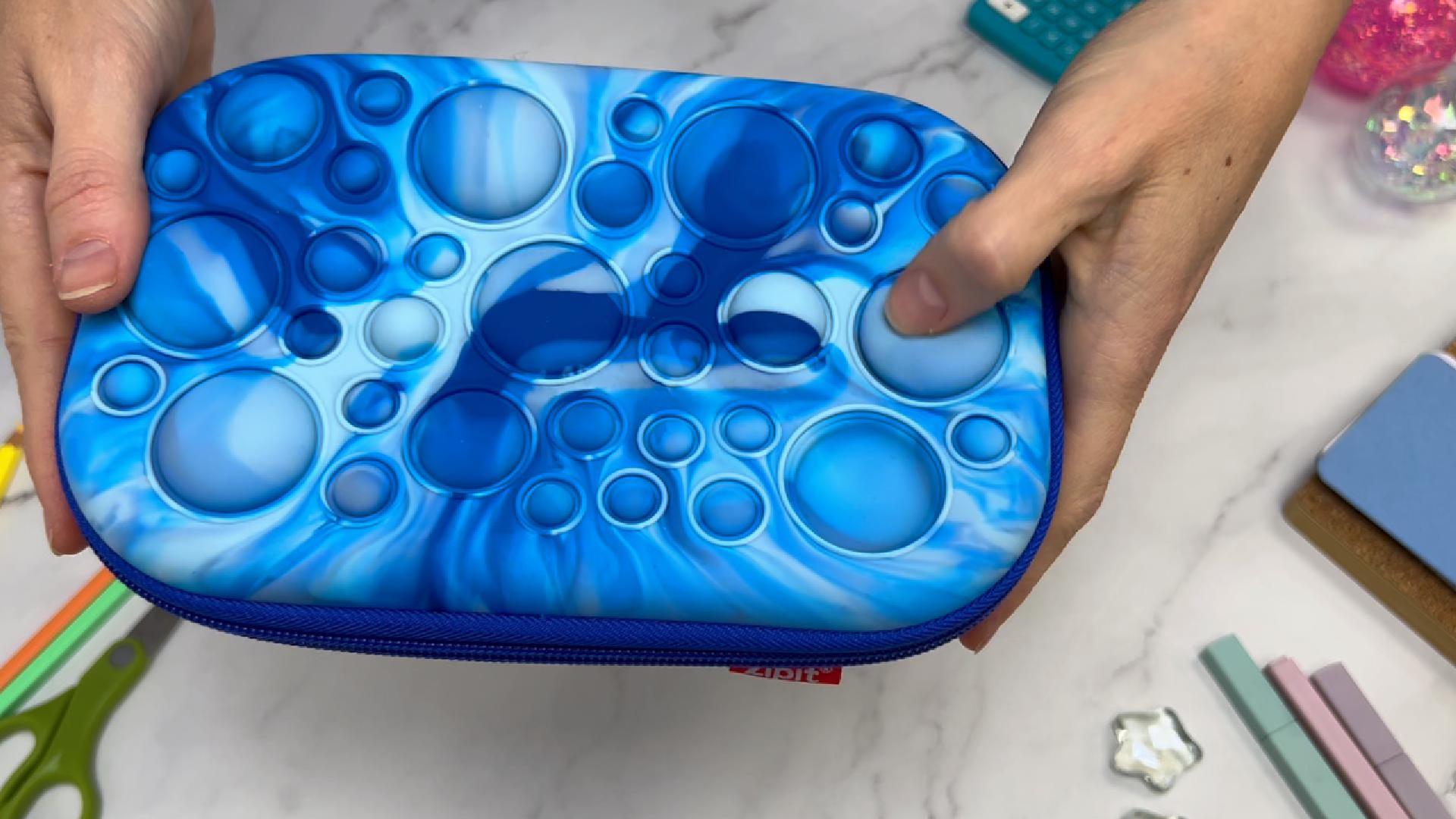thumbnail video image 2 of ZIPIT Bubble Pencil Box for Boys | Fidget Case | Silicon Sensory Push It Case | Large Capacity Pencil Case (Blue), 2 of 9