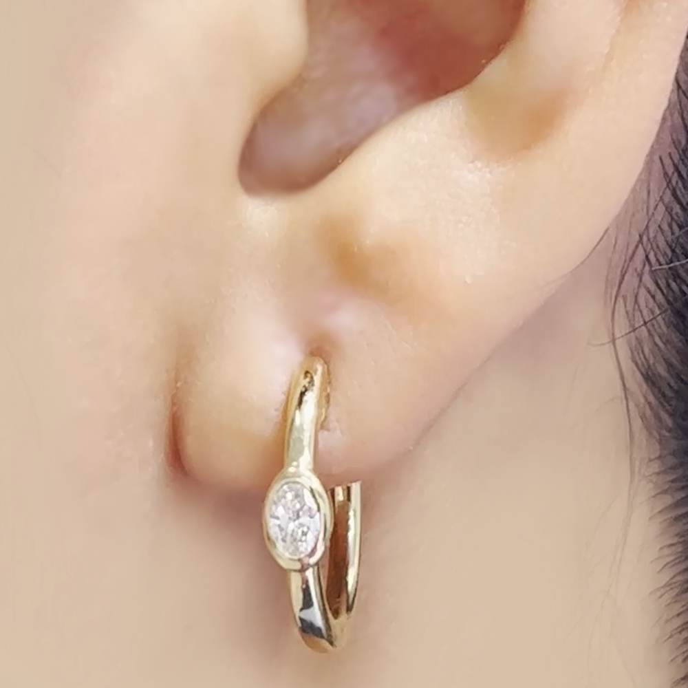 thumbnail video image 2 of Half Carat Oval Lab Diamond Bezel Huggie Earring - Fascinating Diamonds, 2 of 6