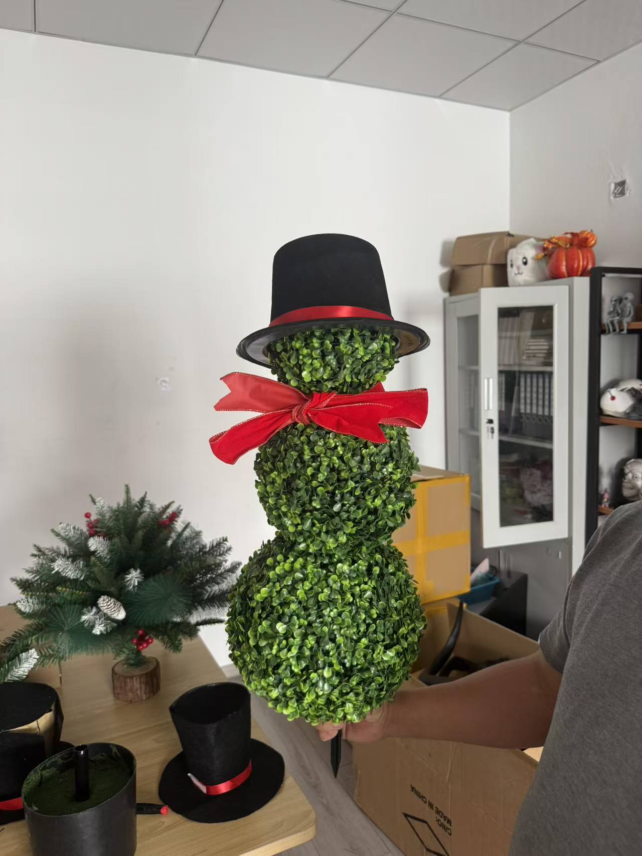 thumbnail video image 2 of Christmas Snowman Shaped Topiary Trees – 3ft High Christmas Artificial Boxwood – Santa Hat and Red Bow Tie – Indoor & Outdoor Decor,(3D), 2 of 10