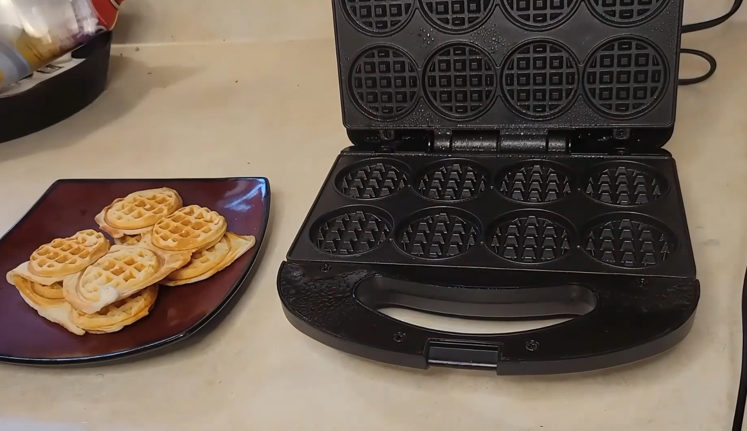 thumbnail video image 2 of Mailand 8 x 2'' Mini Waffle Maker Machine, Waffle Iron, Non Stick Surface, Brush & Recipe Included, Black, 2 of 7