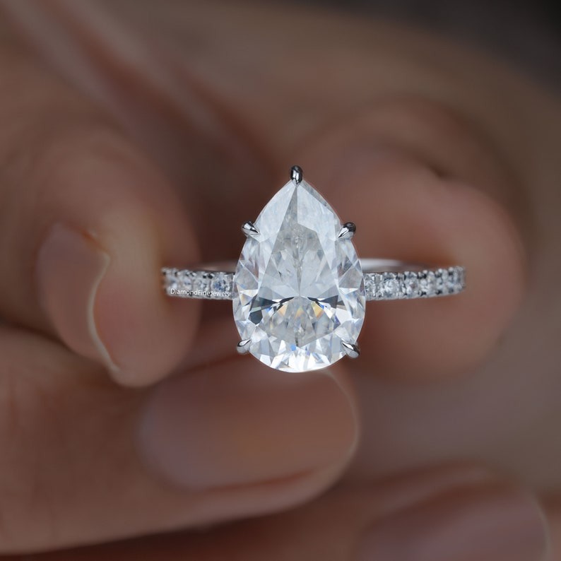 thumbnail video image 2 of SOLITAIRE JEWELS 3CT Pear Cut Moissanite Engagement Ring 18K White Gold Hidden Halo Pave Accent Ring, 2 of 5