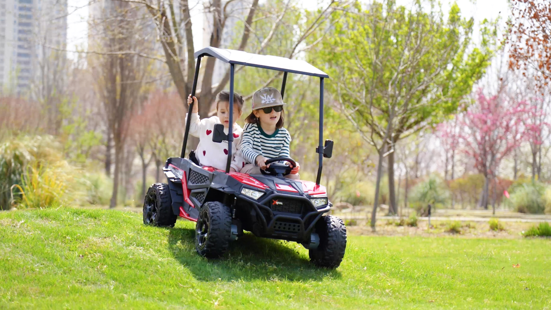 thumbnail video image 2 of Sopbost 24V 4WD Kids Ride On UTV with Remote Control, 2 Seater Battery Powered Ride On Toy with EVA Tires, Music, Plastic Roof, 3-5 MPH, Ages 3-8, Blue, 2 of 10